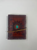Libro de Piel color marron con gema verde y relieve